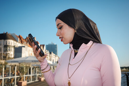 Woman in hijab speaking into phone
