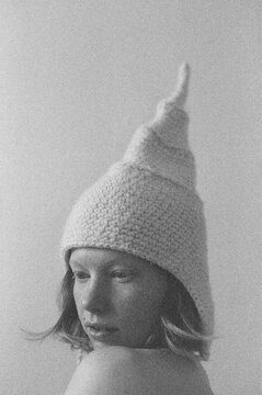 close up portrait of a young woman in a knitted hat