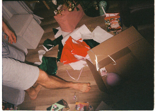 Holiday Gift Wrapping Scattered Around the Christmas Tree
