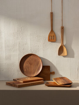 Wooden Kitchenware Collection against a textured wall