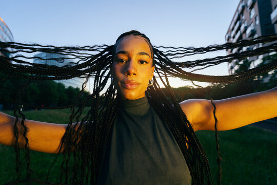 Braids Spread Wide at Sunset