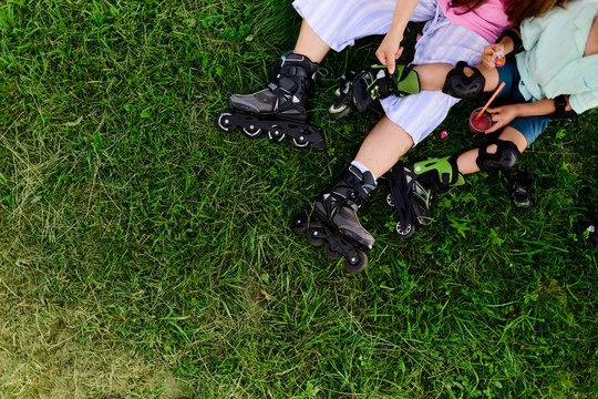 Mother and Child Resting After Roller Skating