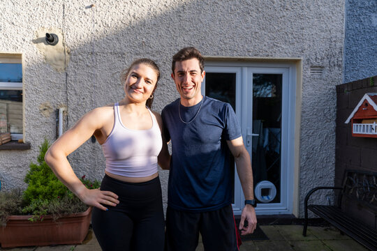 Couple training together in the backyard for fitness goals