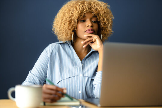 Woman Focusing While Working On Laptop