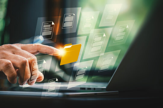 Paperless Office and Data Archiving Concept with Hand Touching Virtual Folder Graphic.