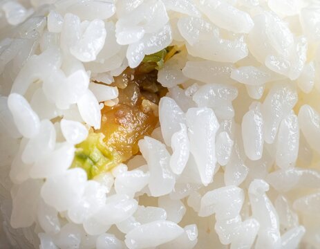 Close-up onigiri texture, rice grain detail with filling center, macro shot, no people
