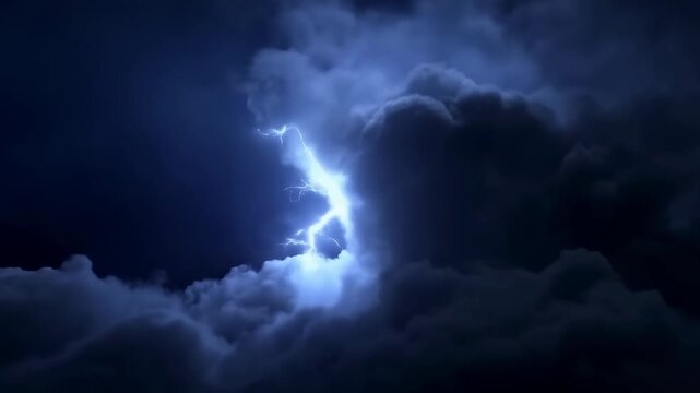 Lightning flashes through dense storm clouds beneath a dark nighttime sky. Weather forecast, severe weather reporting, and storm safety campaign.