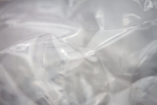 Extreme macro of plastic bubble wrap texture. Selective soft focus, shallow depth of field. Abstract dreamy background