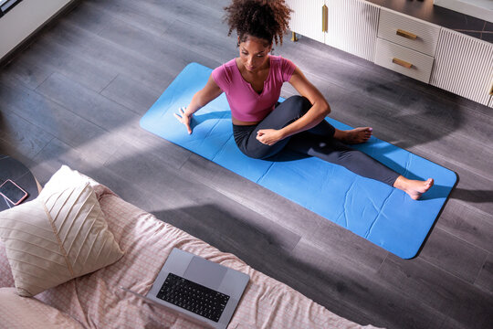 Woman following workout online