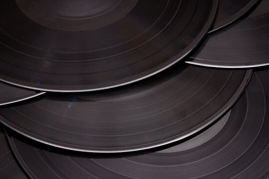 Group of black vintage records. Vinyl records texture, music background. View of phonograph records.
