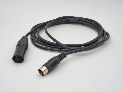 Black XLR to DIN MIDI Cable - A coiled black audio cable featuring a 3-pin XLR male connector on one end and a 5-pin DIN male connector on the other, isolated on a white