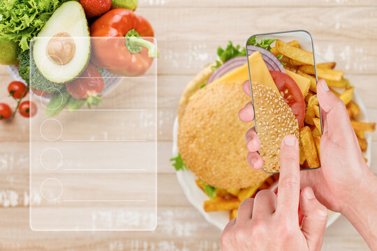Phone photographs a burger with a diet checklist over a produce bowl
