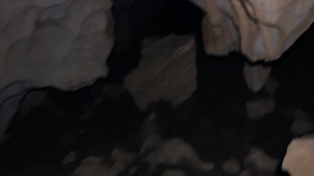 Cave washed in the rock, chute. There is a bottomless delve on the way. Speleological trip. Laos