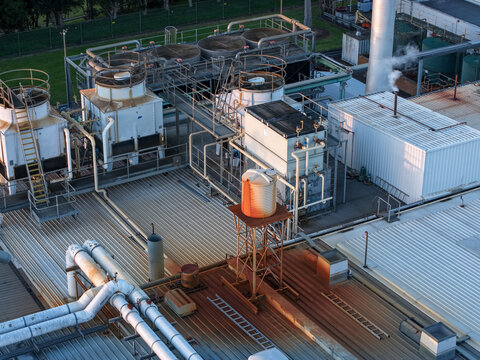 Ringwood, Victoria, Australia - 10 September 2026: Aerial view of the Cadbury Mondelez factory rooftop featuring industrial cooling towers, ventilation systems, and metal piping.