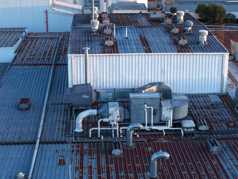 Ringwood, Victoria, Australia - 10 September 2026: Aerial view of the Cadbury Mondelez factory rooftop with weathered metal, ventilation units, and piping systems.