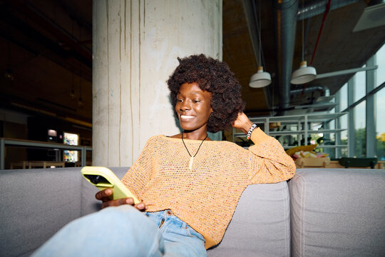Portrait of a casual woman using her phone
