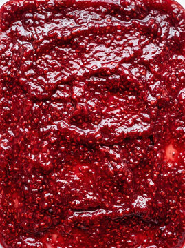 Vibrant red berry seed mixture texture close up macro detail