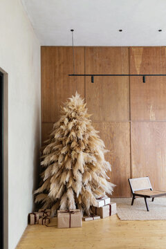 Mock up of modern interior with Christmas tree  with wrapped presents