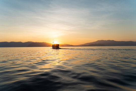 Boat Journey at Sunset. Indonesia