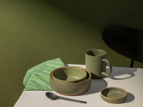 Earthy Ceramic Tableware Set on a textured tablecloth