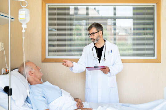 Doctor discussing treatment plan with elderly patient