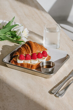 Croissant with raspberries and cheese
