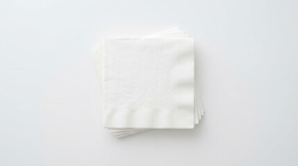 Fototapeta premium White surface with flat laid white paper napkins intended as a blank template for branding or graphic design