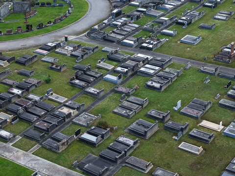 Ferntree Gully, Victoria, Australia - 09 September 2026: Aerial view of Ferntree Gully Cemetery with rows of gravestones and monuments set in a grassy landscape.