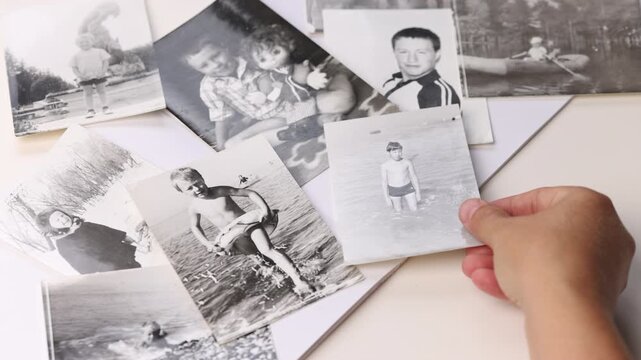 Vintage retro paper photos for photo album laid out on table