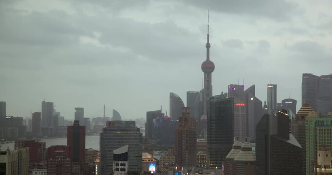 SHANGHAI, CHINA - AUGUST 23, 2026: Night falls over Oriental Pearl Tower and Pudong skyline as city lights illuminate in SHANGHAI CHINA, in timelapse
