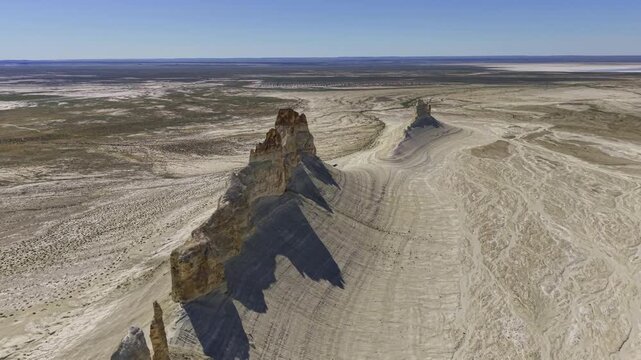 Aerial Forward Tracking Shot Over Desert Rock Ridge