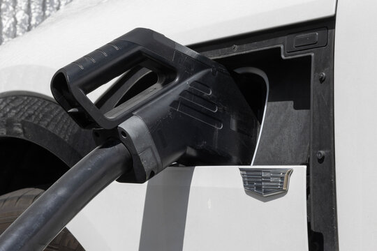 Cadillac LYRIQ All-Electric SUV at a dealership. Cadillac offers the LYRIQ EV with up to 326 miles of driving range. MY:2025