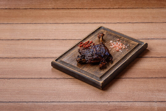Duck leg confit roasted with salt and allspice. Duck leg confit