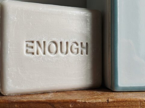 Enough Soap Bars with Minimal Wellness Message on Wooden Shelf