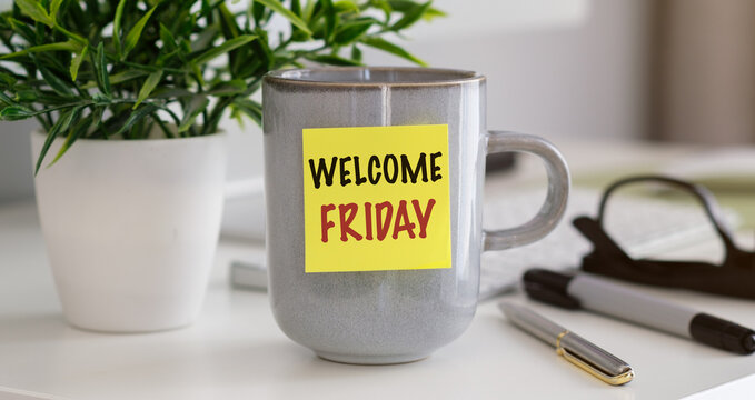 Gray mug holds a cheerful Welcome Friday note. Potted plant adds green, fresh energy to the scene. Desk items suggest a busy, productive day.