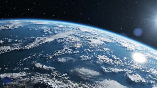 Earth orbit sunrise with sun glint over clouds seen from space during dawn