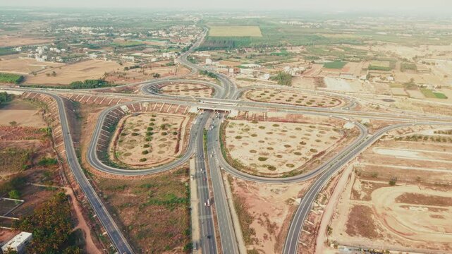  Aerial view of the new Bengaluru-Chennai Expressway cloverleaf interchange near Hoskote, India.