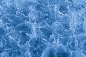 Fototapeta premium Intricate crystalline patterns of blue ice frost close-up