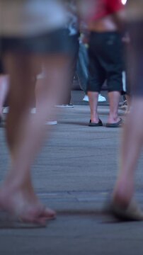 SHANGHAI, CHINA - AUGUST 23, 2026: Pedestrians and shoppers walk across a busy urban pavement showing various footwear in SHANGHAI, CHINA, in timelapse