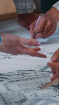 Casual informal five people working office conference with blueprint draw charts building plan drawing work together business team coworking group designers engineers architects paperwork architecture