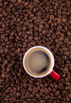 Espresso against a background of coffee beans