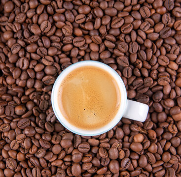 Espresso against a background of coffee beans