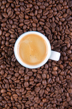 Espresso against a background of coffee beans