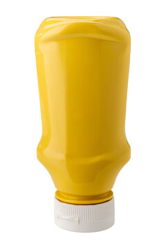 An upside-down yellow plastic squeeze bottle for mustard condiment, blank with no label and closed with a white plastic cap, isolated on white background with clipping path