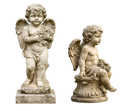 Stone cherubs statues with wings sitting down and standing holding flowers. Angel like figures on stone base transparent background