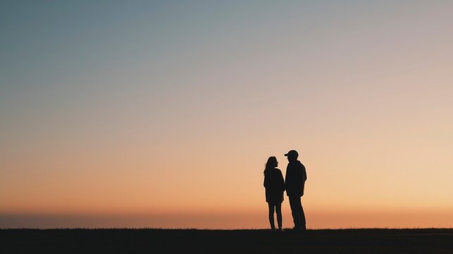 Quiet Connection in Silhouette &mdash; two people stand close against a glowing horizon, using simple forms and subtle body language to express trust, emotion, and silent connection.