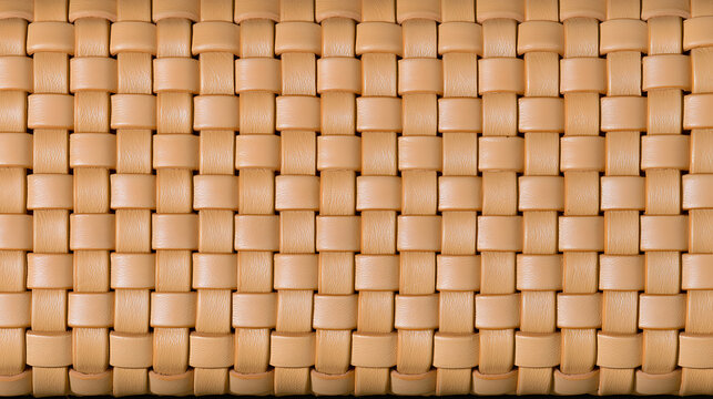Tan leather woven texture background close up for design element with interlocked strips pattern in beige tone for stylish commercial project