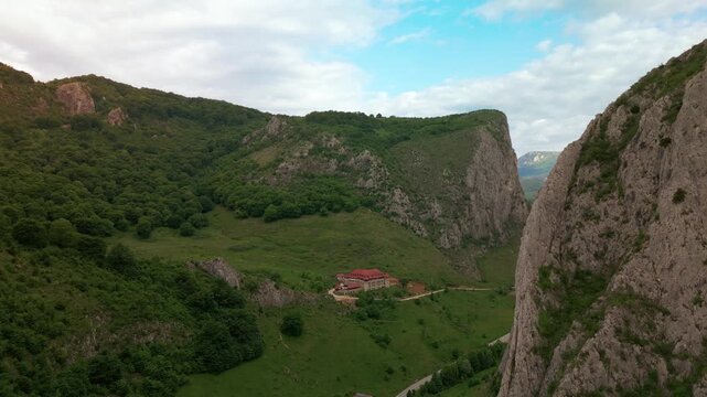 Templul cavalerilor castle stands on a green hill overlooking the trascau mountains