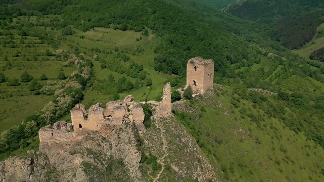 Aerial view of fortress ruins overlooking trascau mountains in transylvania