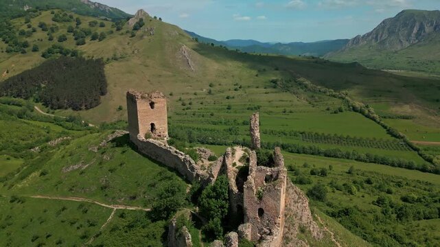 Aerial view of fortress ruins overlooking trascau mountains in transylvania